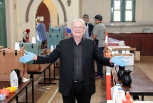 Rev. Bill Crews next to the statue of the Godess of Democracy.