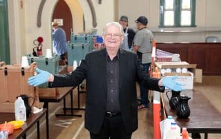Rev. Bill Crews next to the statue of the Godess of Democracy.