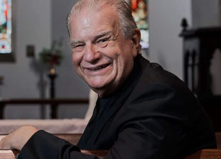 Rev. Bill Crews sitting in Ashfield Uniting church.