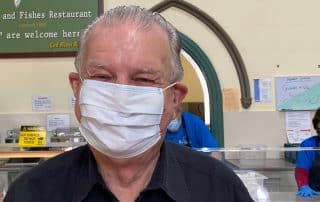 Rev. Bill Crews wearing a fascemask.