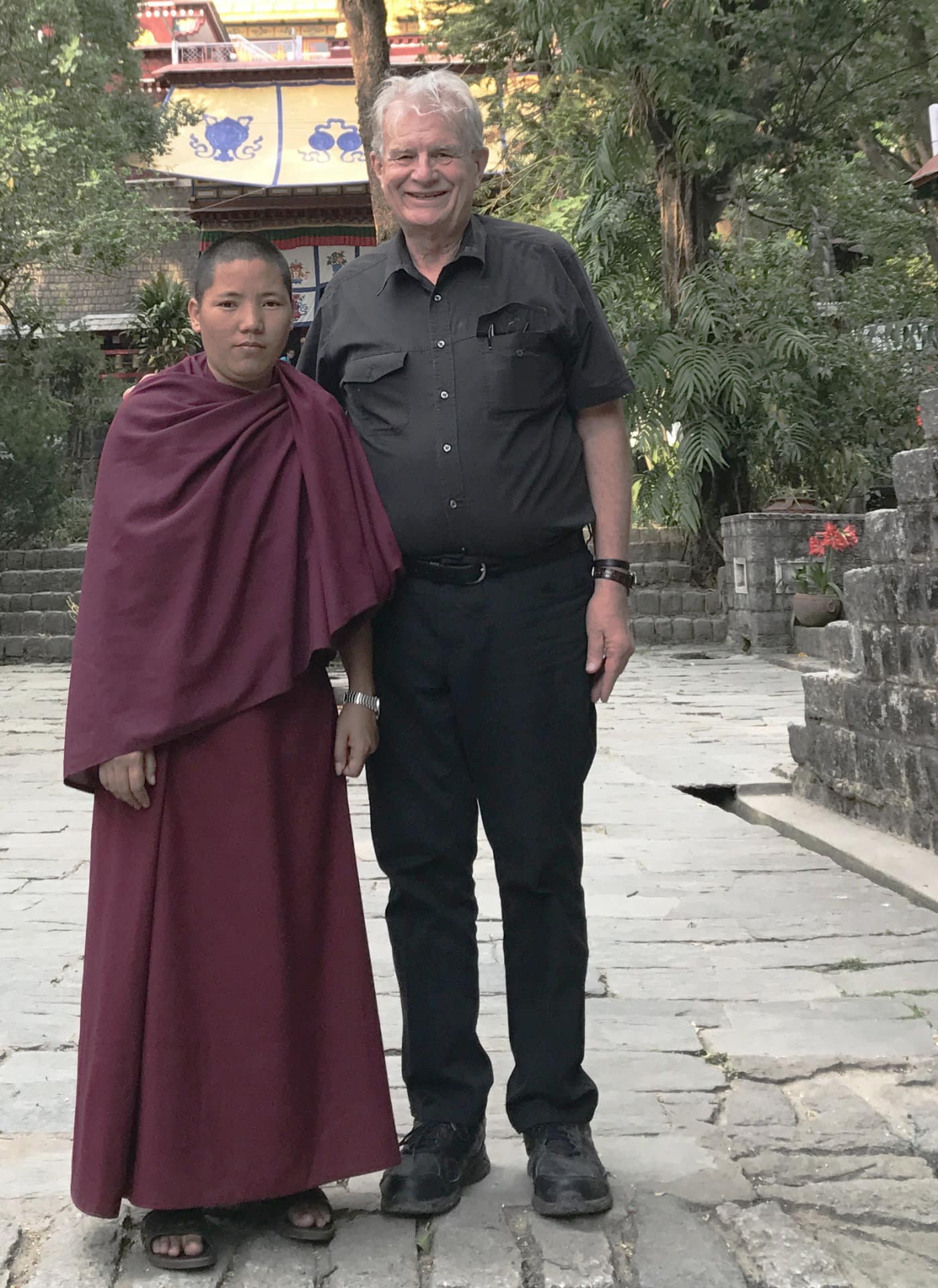Bill Crews with a monk on a visit to Dharamshala, Tibet.