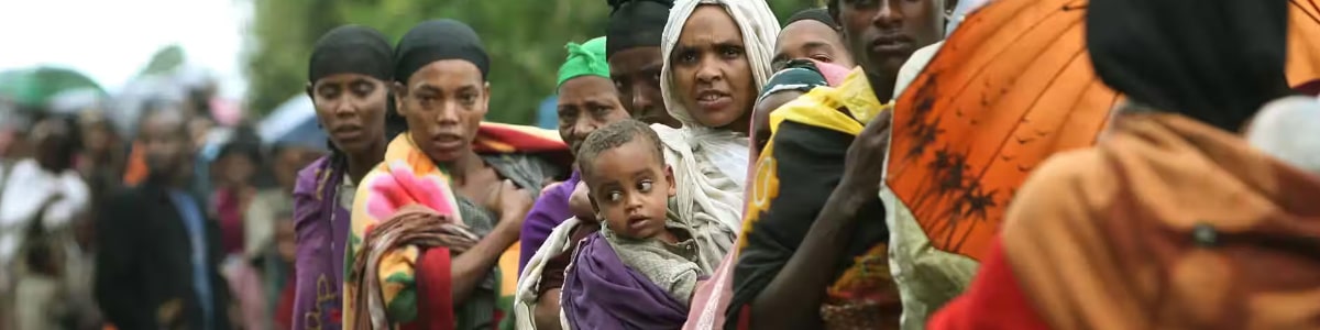 People queuing for food in Africa.