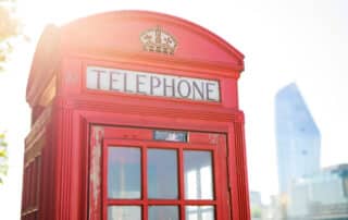 Making a connection via a phone box in Hertford, UK.