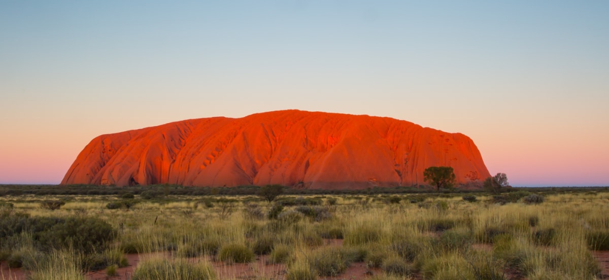 Uluru at sunset inevitably makes us consider Australia Day in 2023.