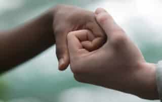 The power of belonging - two hands together.