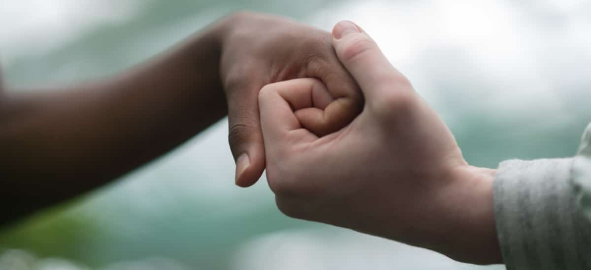 The power of belonging - two hands together.