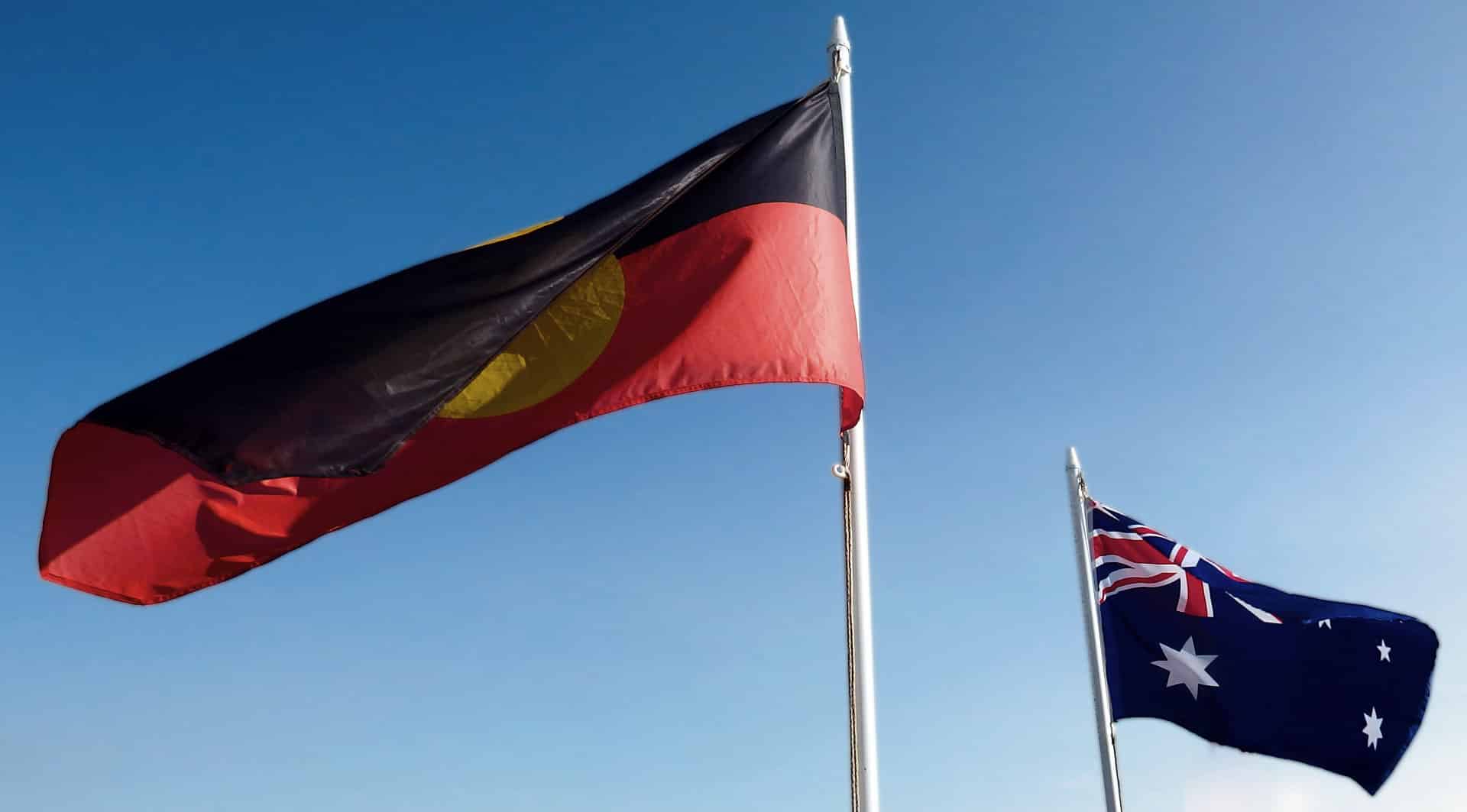 Aboriginal and Australian flags - will the yes vote succeed in the referendum.