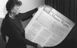 Eleanor Roosevelt holding the Universal Declaration of Human Rights document.
